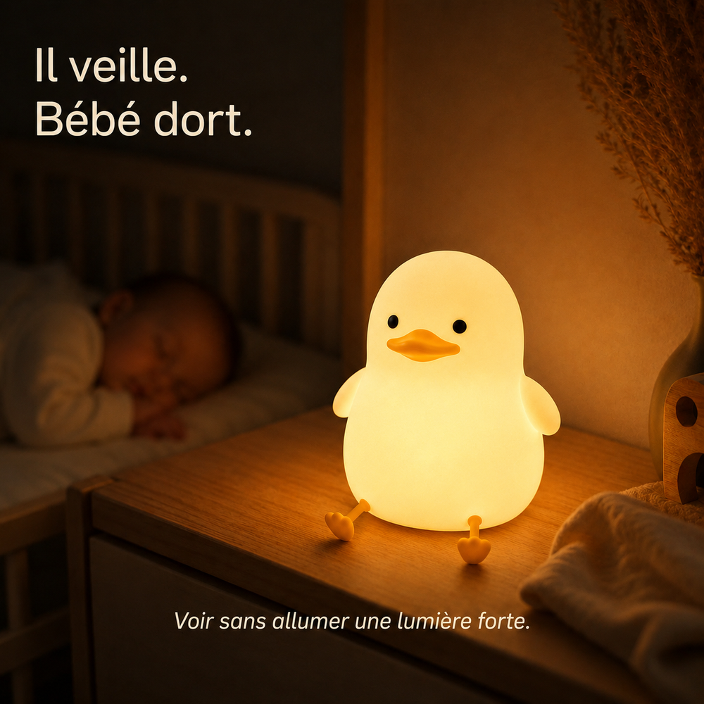 Veilleuse canard lumineuse posée sur une table, éclairage doux en forme de caneton.