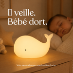 Veilleuse baleine en silicone avec lumière chaude, posée sur un meuble.