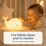 Veilleuse baleine en silicone, lumière chaude, près d’un bébé qui touche la veilleuse.