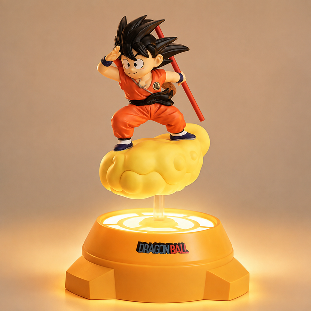 Figurine lumineuse de Goku sur nuage jaune, pose accroupie, baguette rouge, base orange.