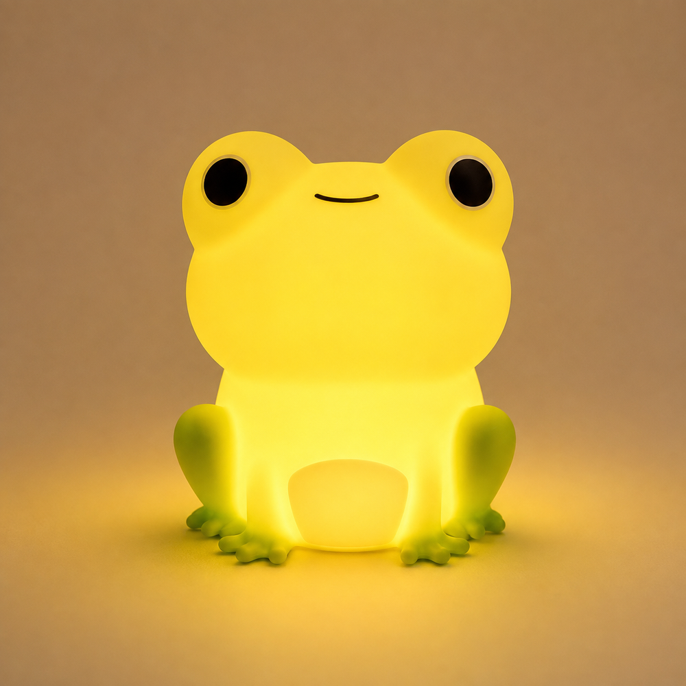 Veilleuse grenouille en silicone jaune, vue de face, lumière diffuse