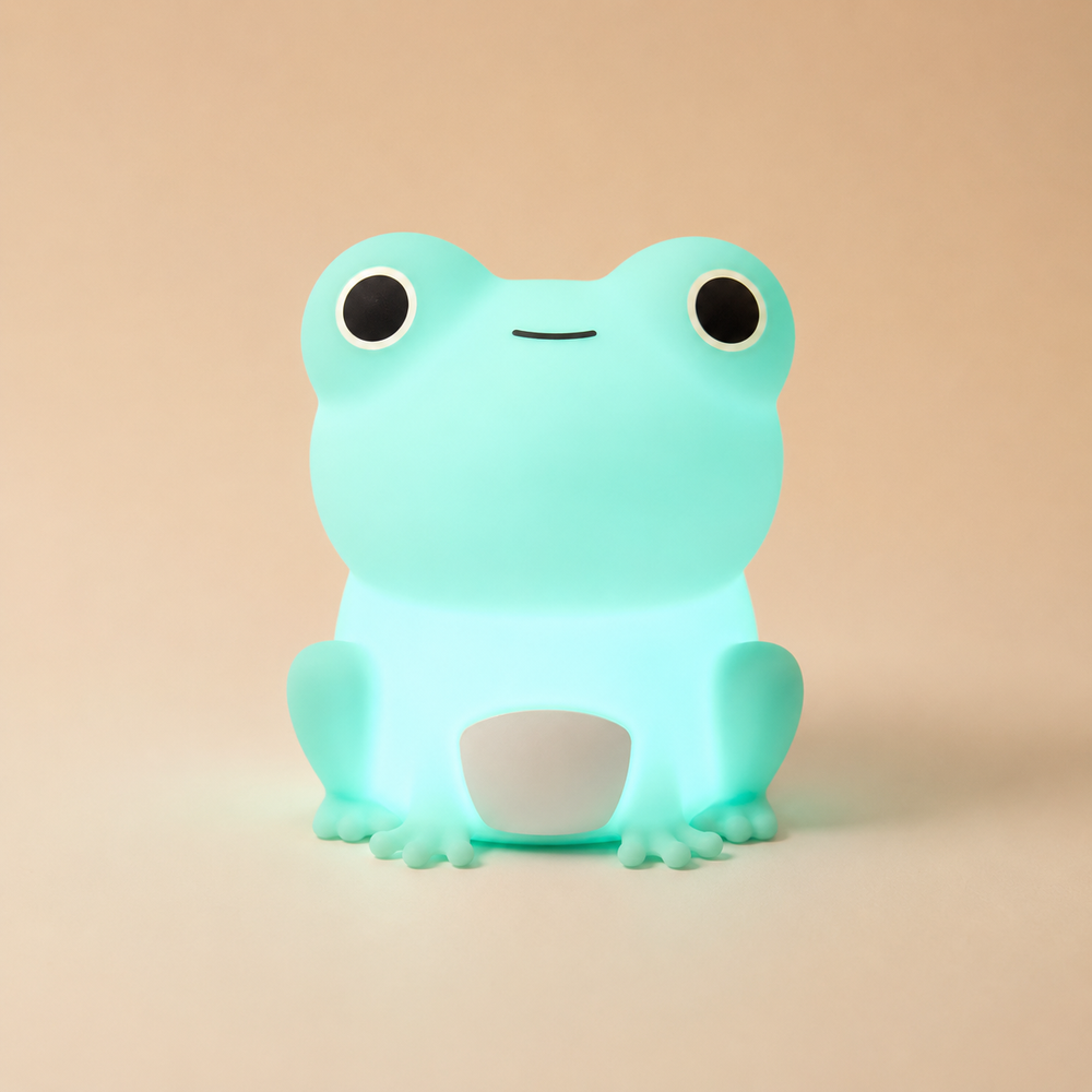 Veilleuse grenouille en silicone vert menthe, vue avant, lumière allumée