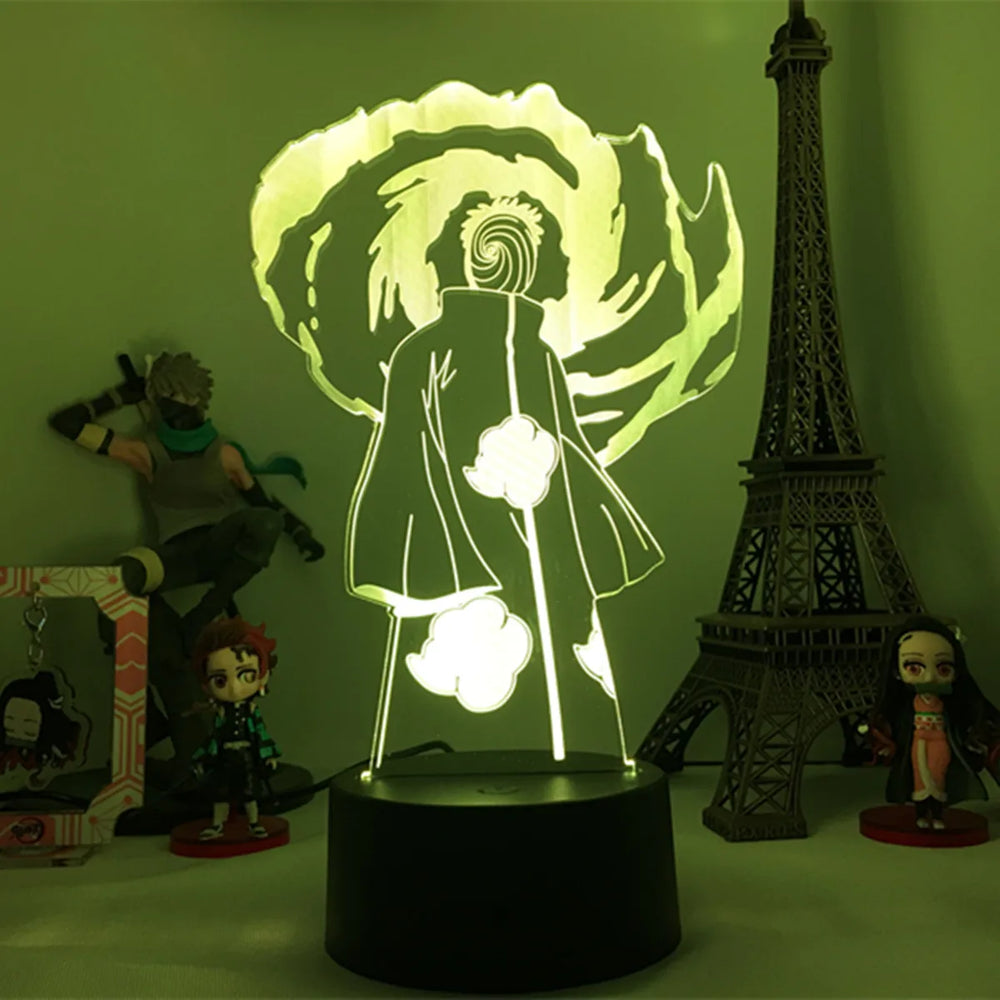 Veilleuse LED 3D manga sur socle noir, personnage de dos avec lumière verte.