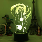 Veilleuse LED 3D manga sur socle noir, personnage de dos avec lumière verte.