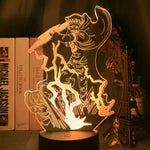 Lampe LED 3D motif de pirate en lignes orange, socle noir cylindrique.